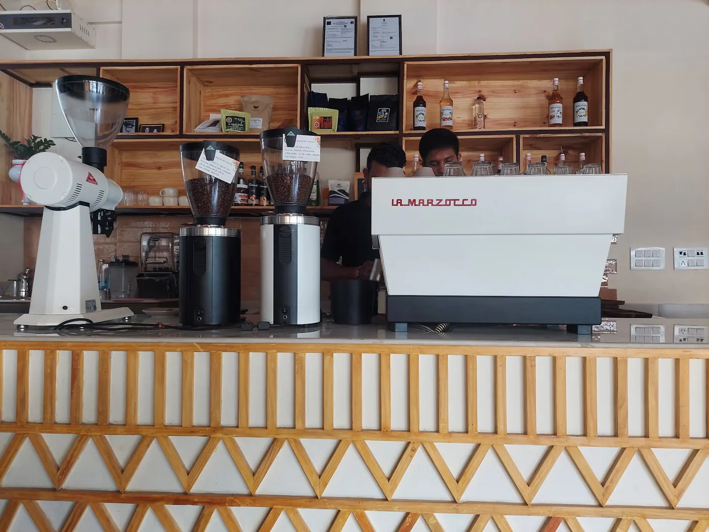 The brew bar above the ochre zigzag counter