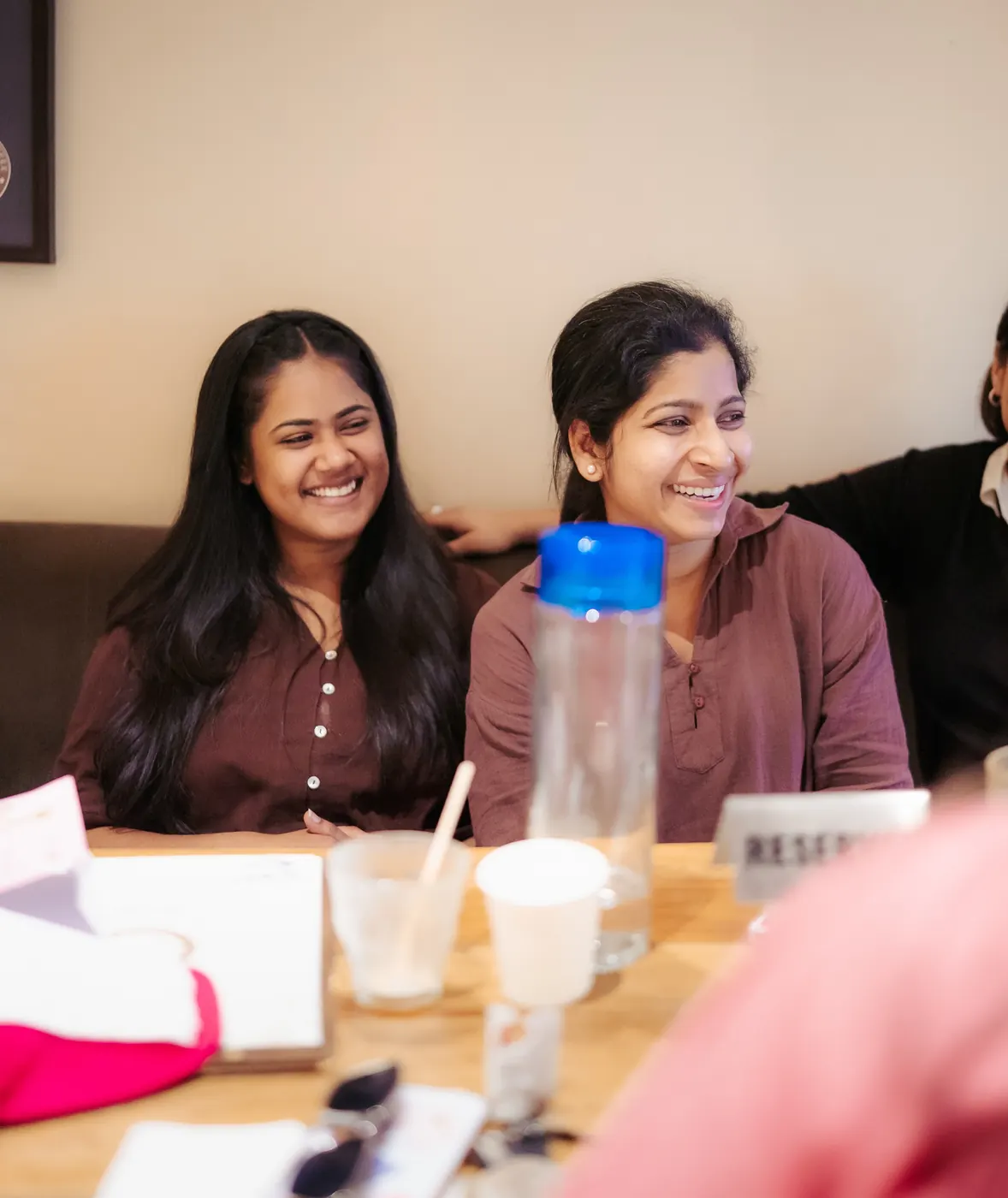 Friends laughing over coffee